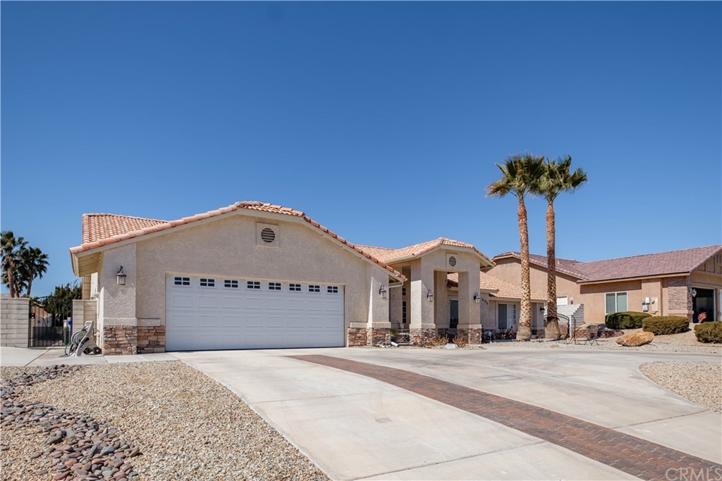 16196 Ridge View Drive Apple Valley, CA 92307 - Photo 5 of 68 a front view of a building with a cars parked