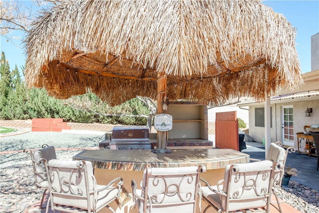 16196 Ridge View Drive Apple Valley, CA 92307 - Photo 52 of 68 a view of a chairs and table in the patio