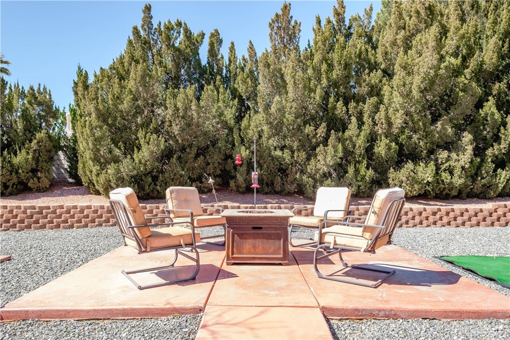 16196 Ridge View Drive Apple Valley, CA 92307 - Photo 54 of 68 a view of backyard with seating area and trees