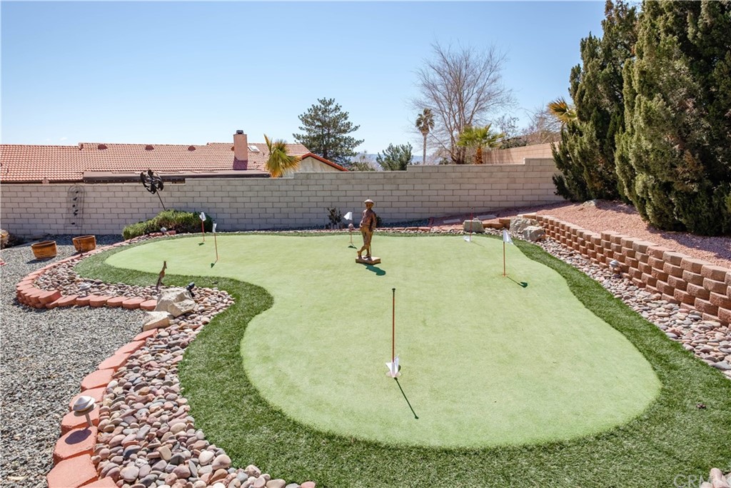 16196 Ridge View Drive Apple Valley, CA 92307 - Photo 57 of 68 a view of a swimming pool with a yard
