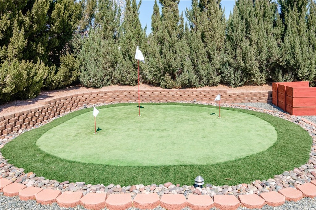 16196 Ridge View Drive Apple Valley, CA 92307 - Photo 58 of 68 a view of a swimming pool with a yard