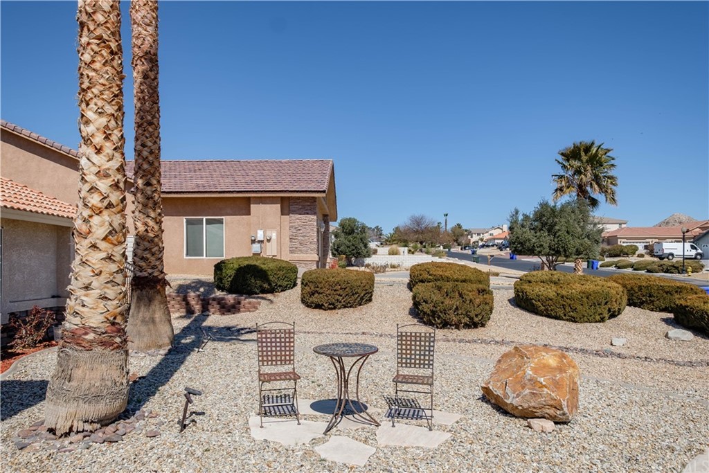 16196 Ridge View Drive Apple Valley, CA 92307 - Photo 7 of 68 a view of a patio with couches and potted plants