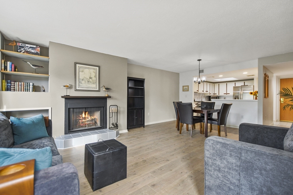 431 Place Lane, Unit 431 Woburn, MA 01801 - Photo 14 of 38 a living room with furniture and a fireplace