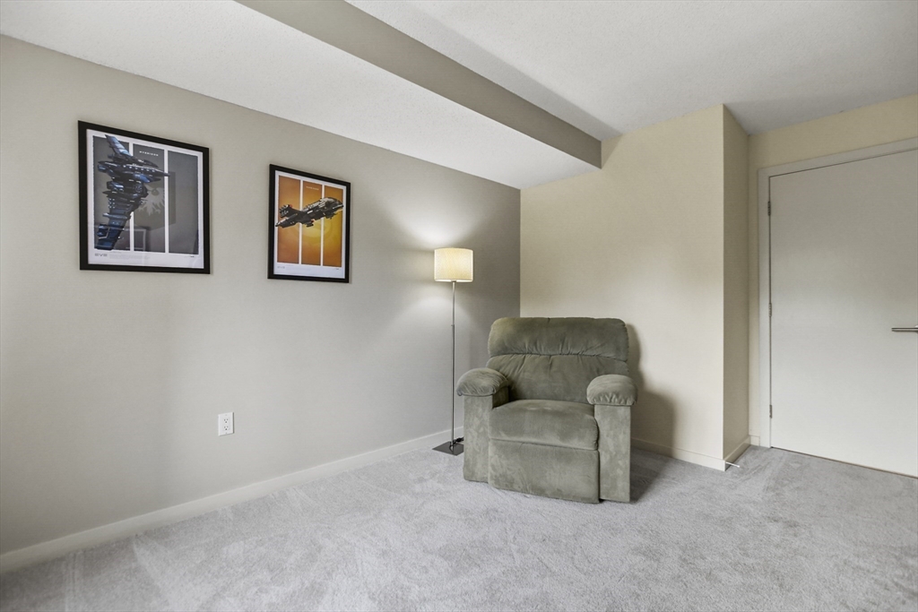 431 Place Lane, Unit 431 Woburn, MA 01801 - Photo 17 of 38 a view of livingroom with furniture and window