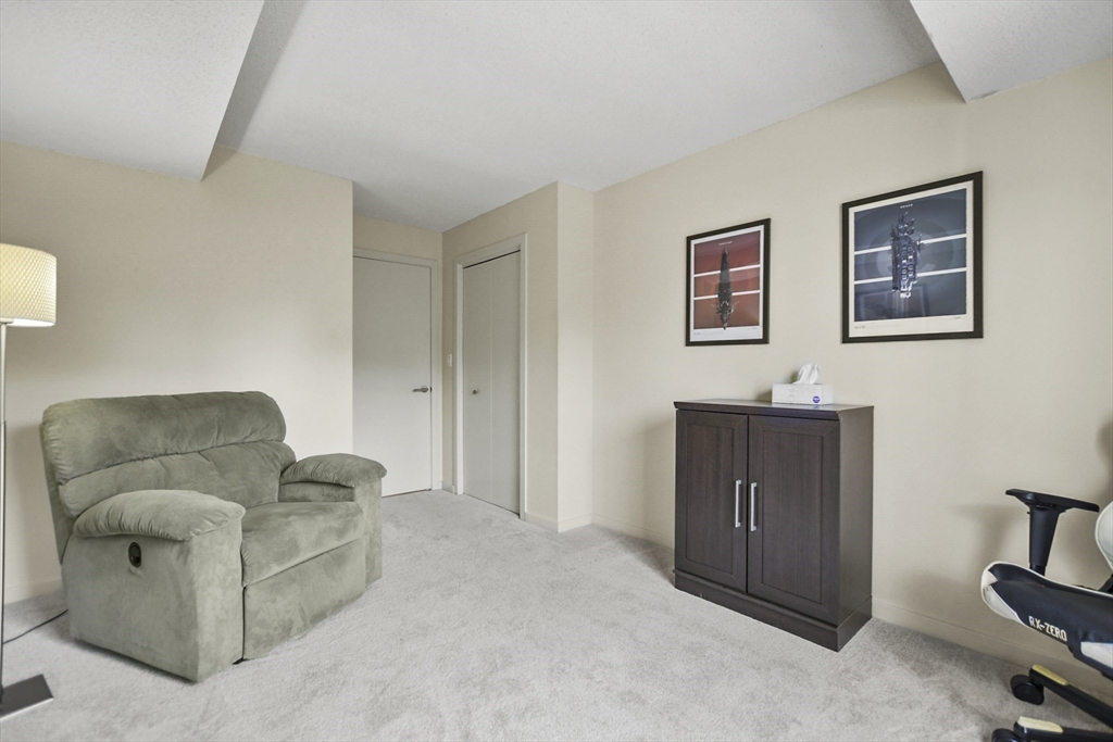 431 Place Lane, Unit 431 Woburn, MA 01801 - Photo 18 of 38 a living room with furniture and a couch