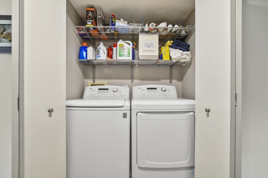 431 Place Lane, Unit 431 Woburn, MA 01801 - Photo 28 of 38 a utility room with dryer and washer