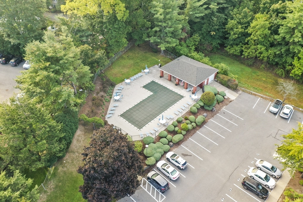 431 Place Lane, Unit 431 Woburn, MA 01801 - Photo 30 of 38 an aerial view of a house with a garden and lake view