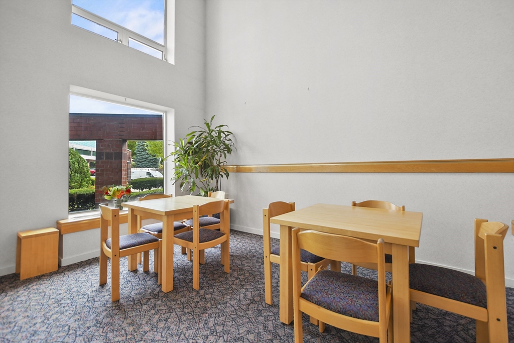 431 Place Lane, Unit 431 Woburn, MA 01801 - Photo 34 of 38 a dining room with furniture and window