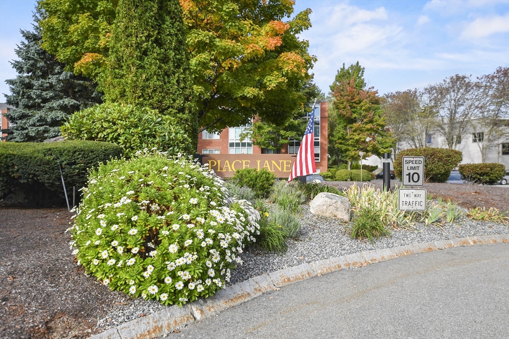431 Place Lane, Unit 431 Woburn, MA 01801 - Photo 38 of 38 a street view with tall buildings