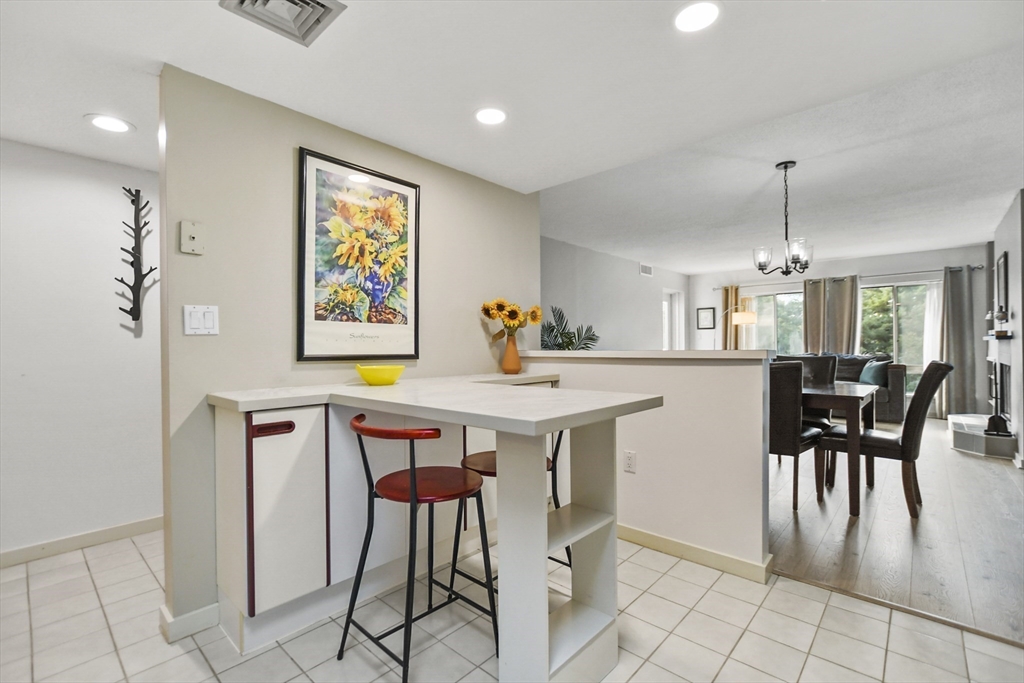 431 Place Lane, Unit 431 Woburn, MA 01801 - Photo 7 of 38 a view of a dining room with furniture