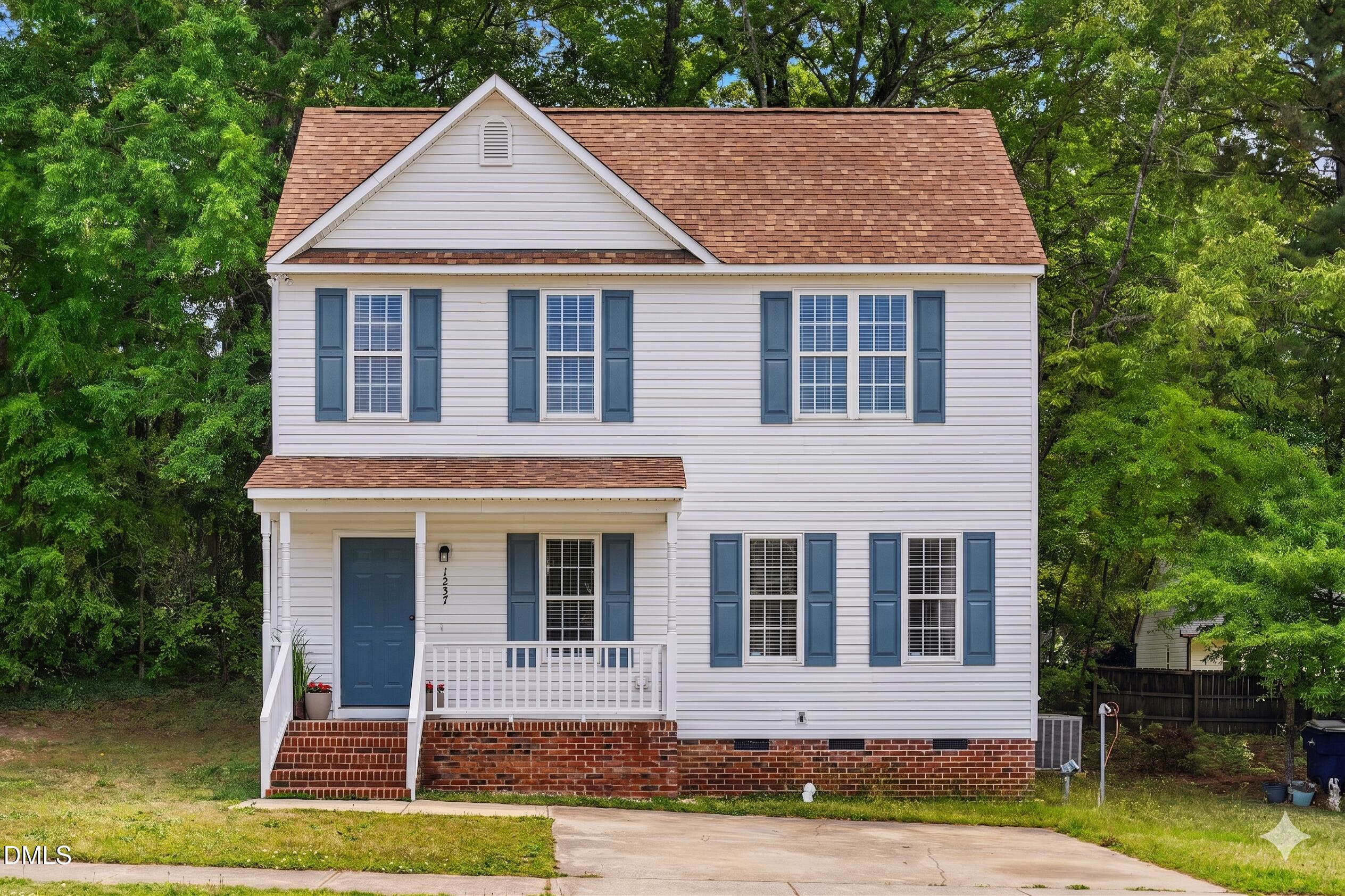 1237 Swingline Way Raleigh, NC 27610 - Photo 1 of 14 a front view of a house with a yard