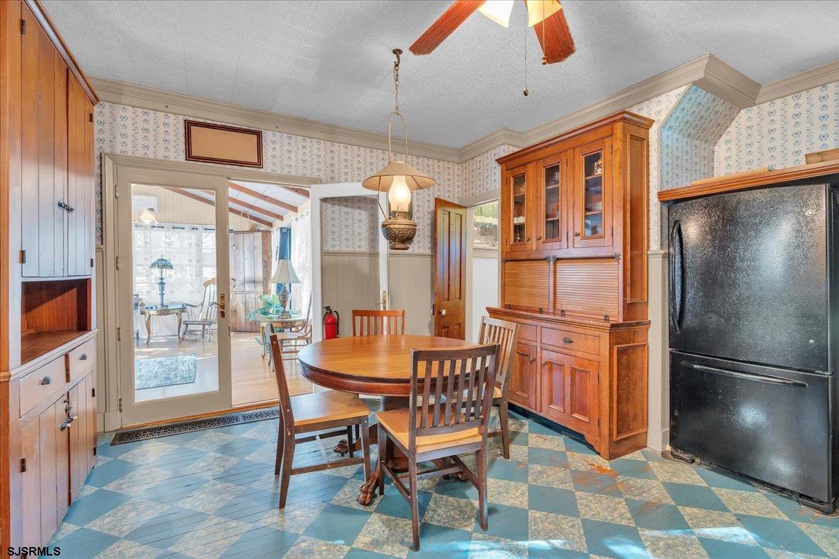 56 Main Street Port Republic, NJ 08241 - Photo 17 of 44 a dining room with furniture and a floor to ceiling window