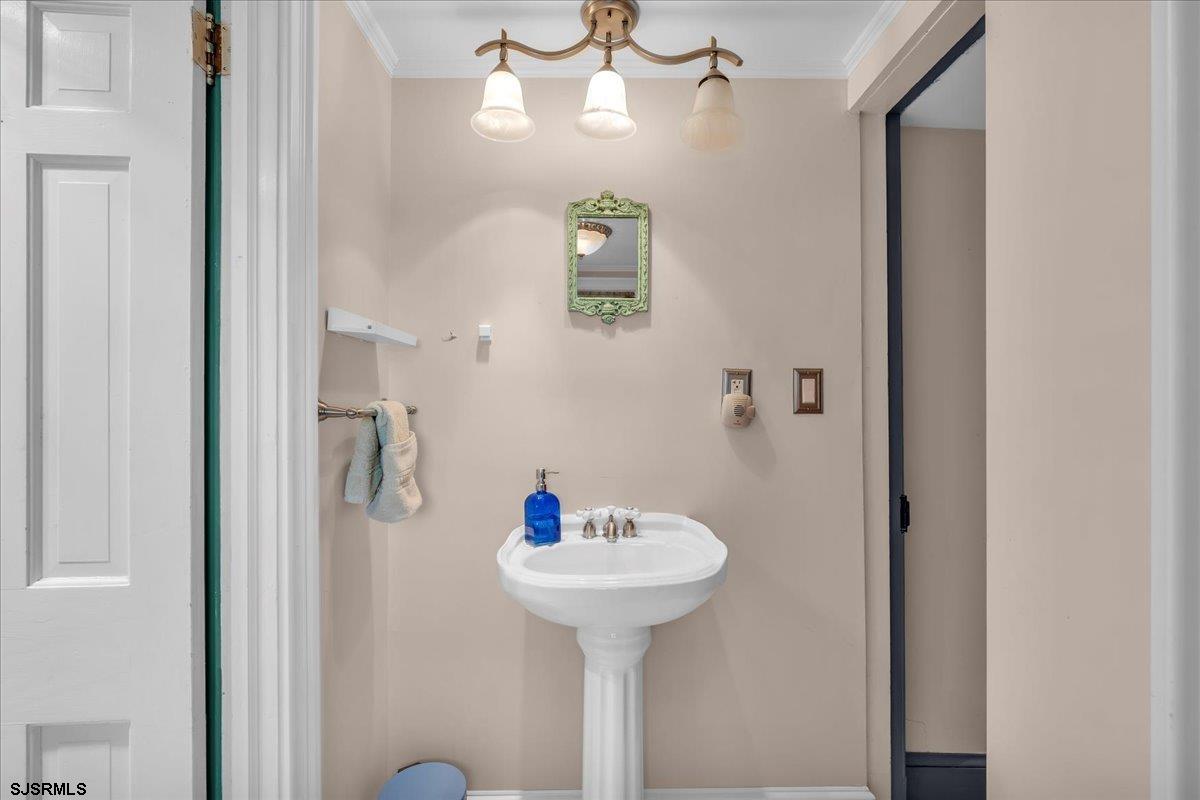 56 Main Street Port Republic, NJ 08241 - Photo 22 of 44 a bathroom with a sink and a mirror