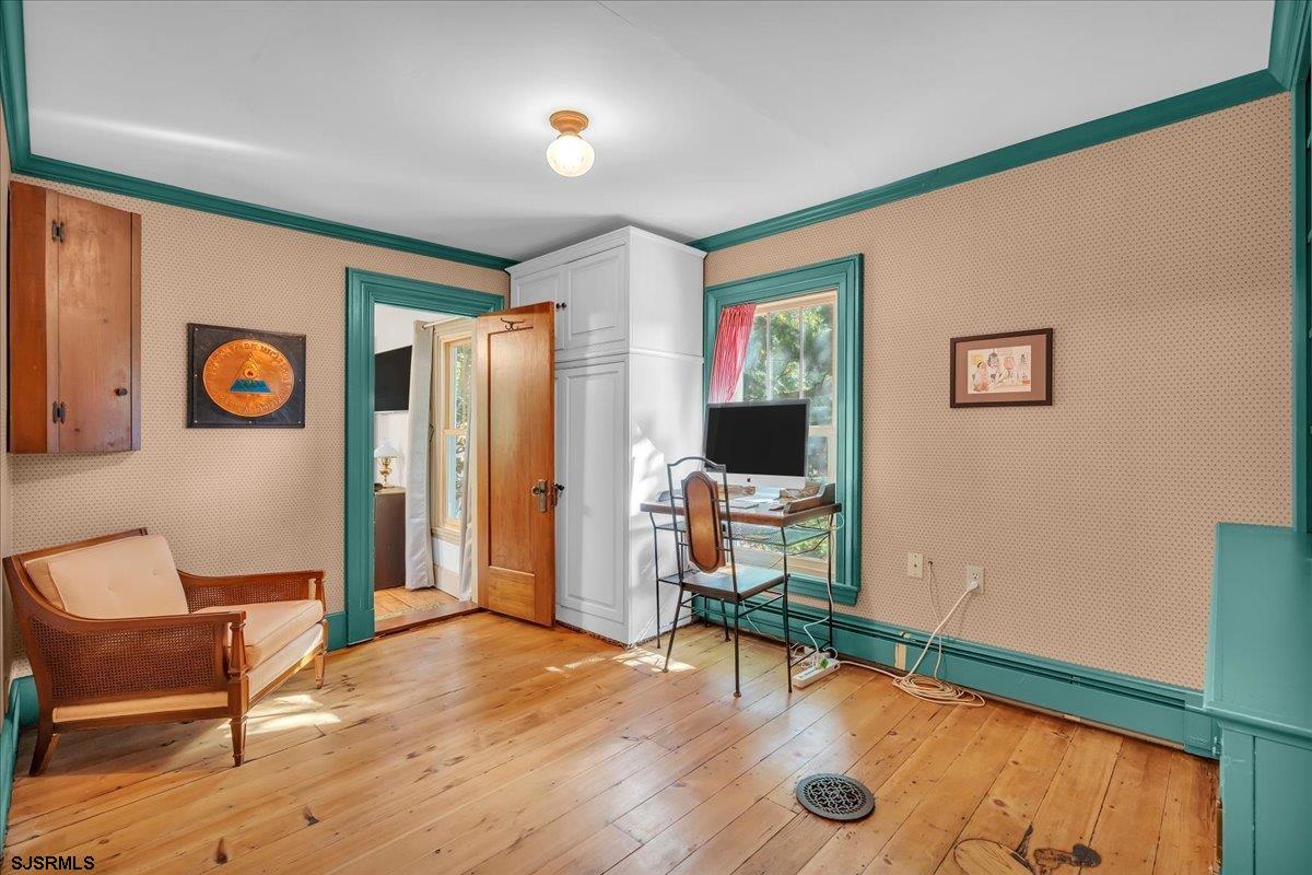 56 Main Street Port Republic, NJ 08241 - Photo 29 of 44 a living room with furniture and a flat screen tv