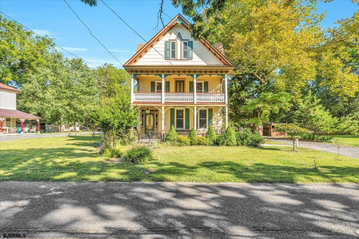 56 Main Street Port Republic, NJ 08241 - Photo 3 of 44 a front view of a house with a yard