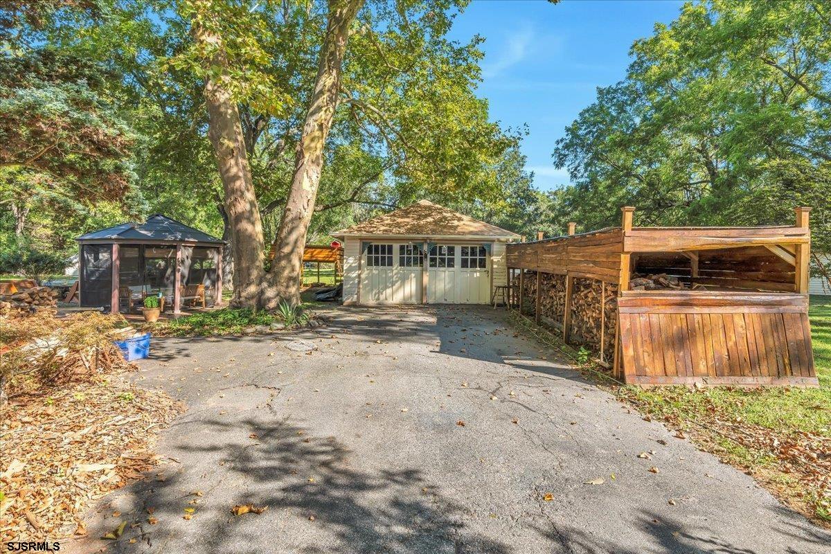 56 Main Street Port Republic, NJ 08241 - Photo 38 of 44 a view of a house with a yard and sitting area