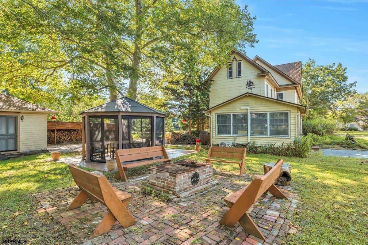 56 Main Street Port Republic, NJ 08241 - Photo 39 of 44 a front view of a house with a yard