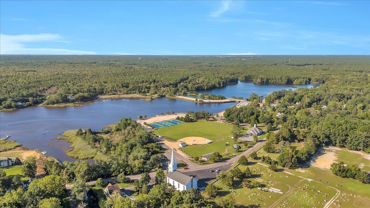 56 Main Street Port Republic, NJ 08241 - Photo 43 of 44 an aerial view of residential houses with outdoor space and swimming pool