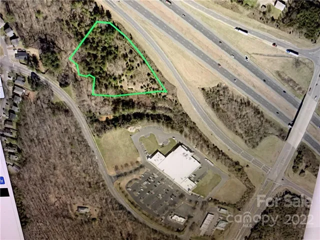 a view of a floor to ceiling window and lake view