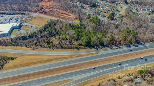 a view of swimming pool with a yard and outdoor seating