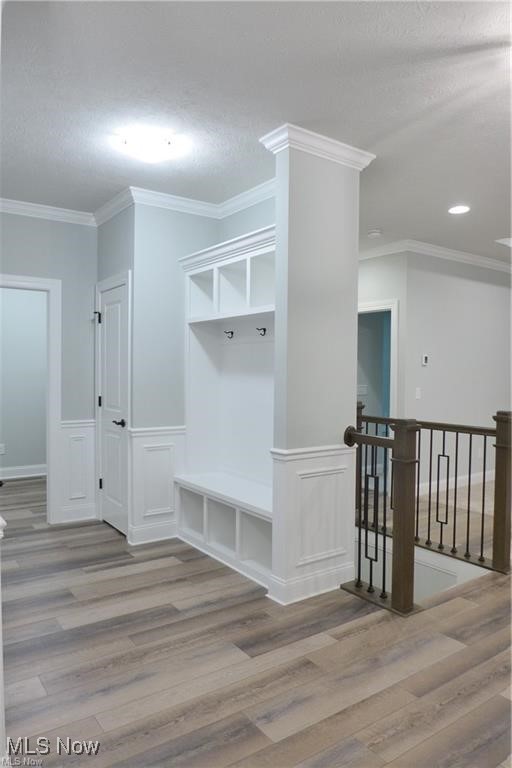 32028 Chestnut Ridge Road North Ridgeville, OH 44039 - Photo 7 of 39 Mudroom with ornamental molding and hardwood / wood-style floors