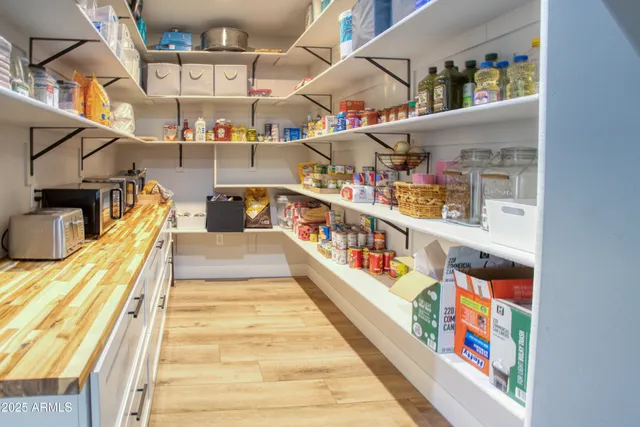 a living room with furniture ceiling fan and a window