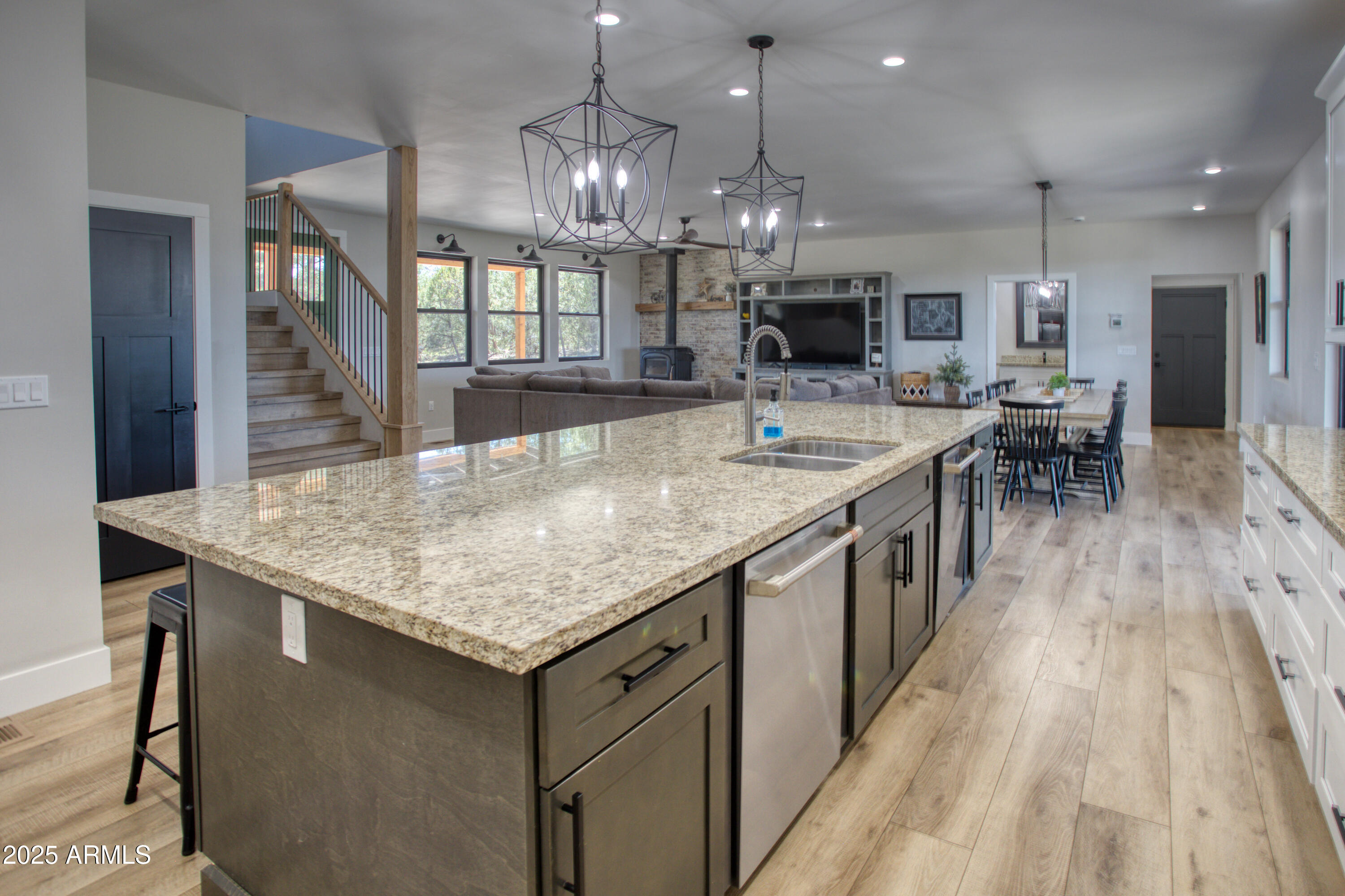 1850 Pinecone Heber, AZ 85928 - Photo 15 of 40 an open kitchen with a table and chairs in it