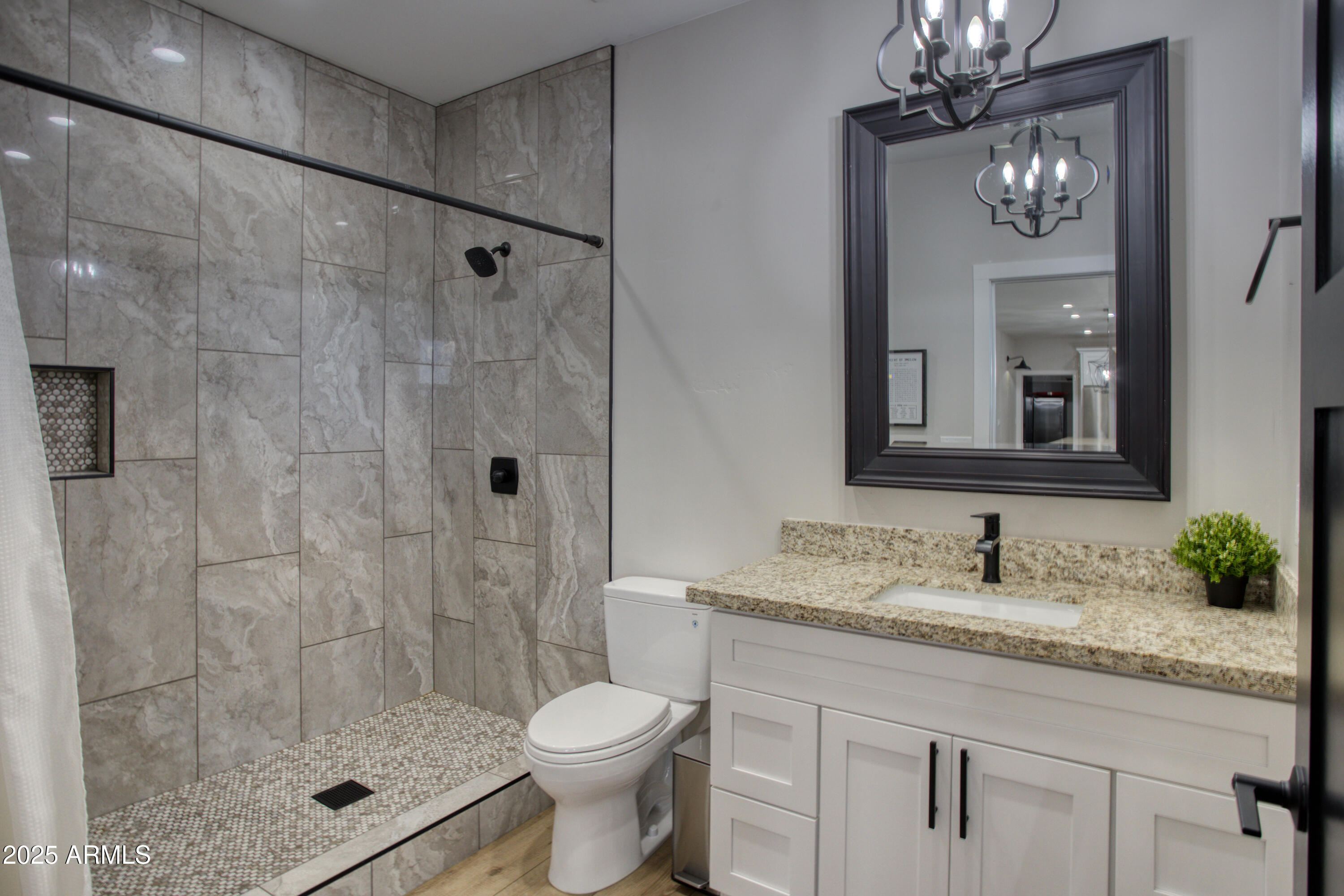 1850 Pinecone Heber, AZ 85928 - Photo 22 of 40 a bathroom with a granite countertop sink a toilet and a mirror