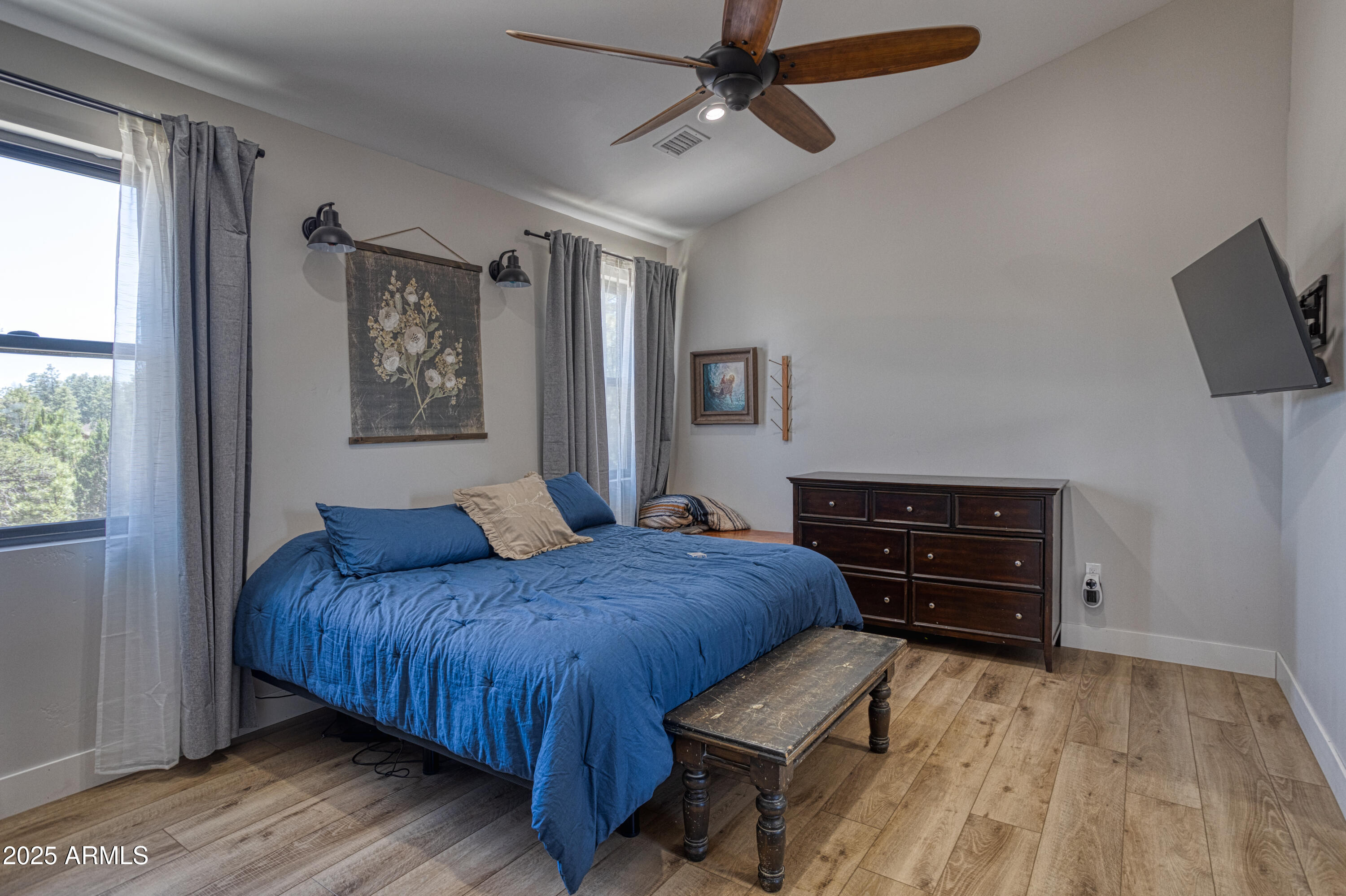 1850 Pinecone Heber, AZ 85928 - Photo 23 of 40 a bedroom with a bed window and a flat screen tv