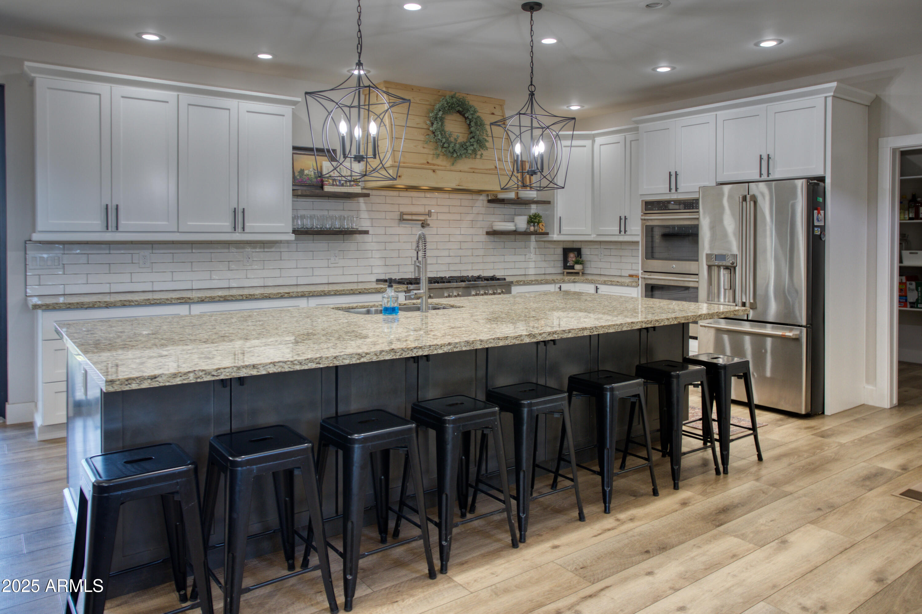 1850 Pinecone Heber, AZ 85928 - Photo 5 of 40 a kitchen with stainless steel appliances granite countertop a table chairs sink refrigerator and microwave