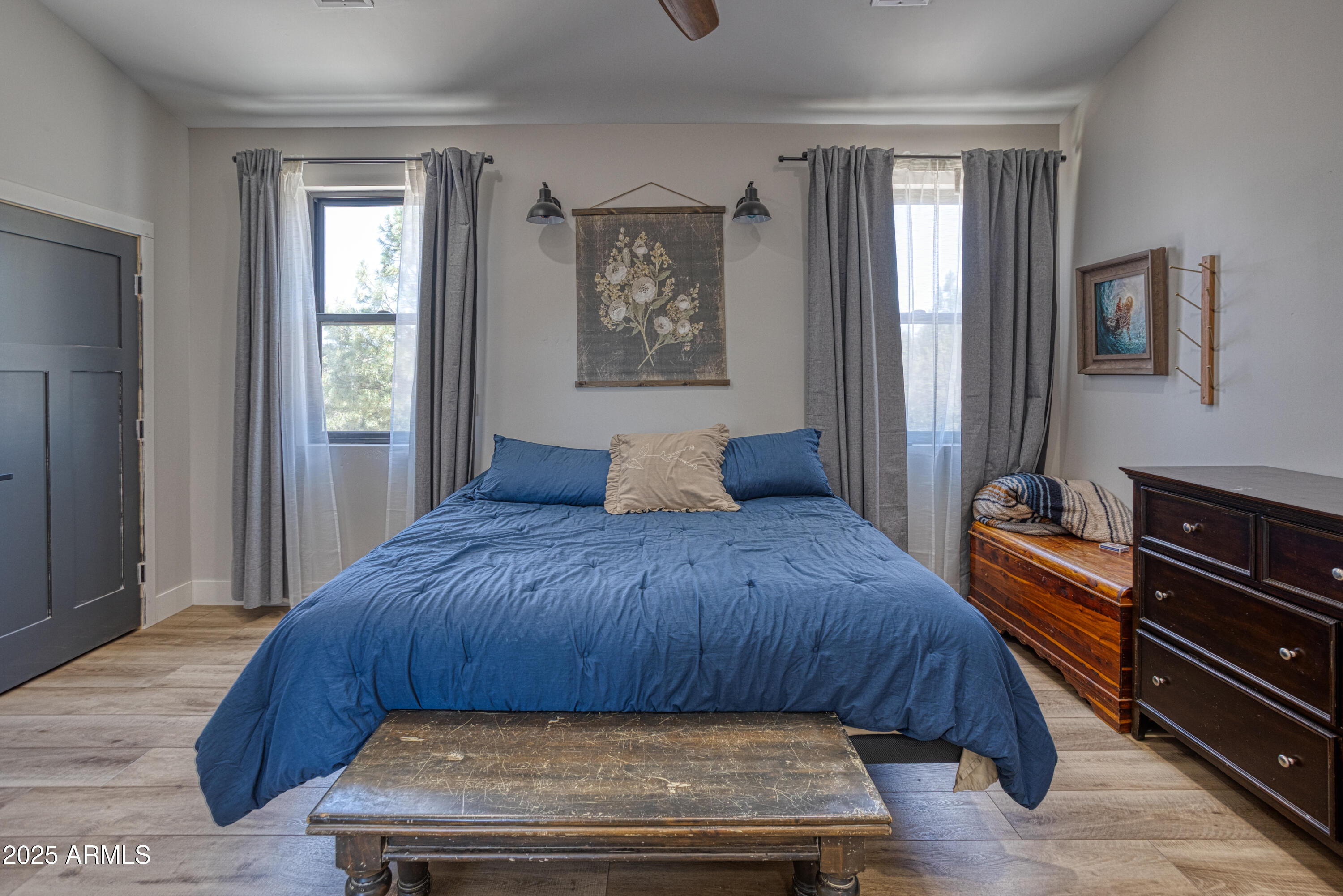 1850 Pinecone Heber, AZ 85928 - Photo 8 of 40 a bedroom with a bed and dresser with mirror