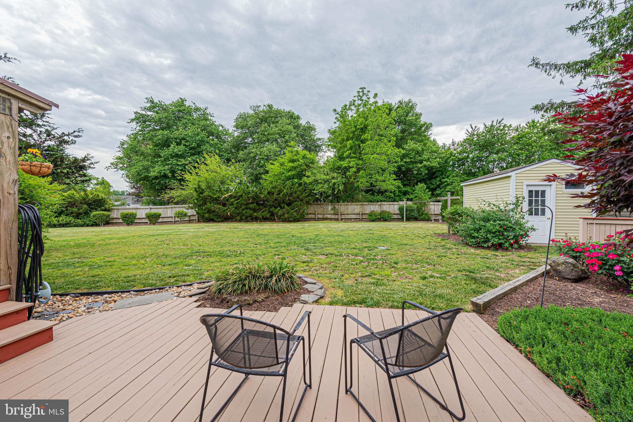 31468 Wingate Road Dagsboro, DE 19939 - Photo 40 of 48 a view of a wooden deck and a yard