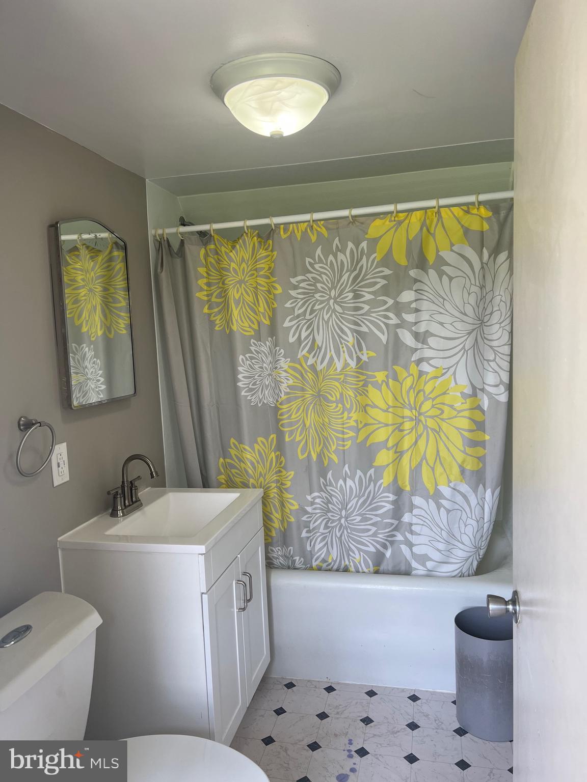 6860 Montgomery Road Elkridge, MD 21075 - Photo 4 of 7 a bathroom with a sink toilet and tub