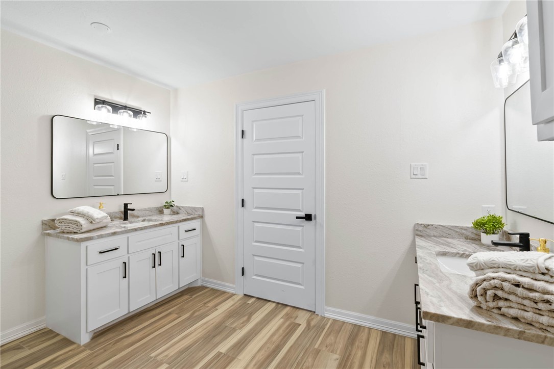 1906 Oak Ridge Drive Portland, TX 78374 - Photo 12 of 20 a bathroom with a sink a mirror and a