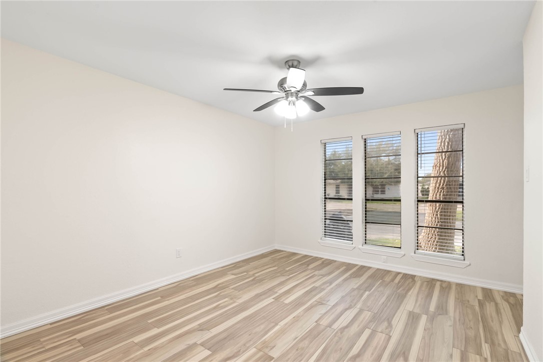 1906 Oak Ridge Drive Portland, TX 78374 - Photo 18 of 20 wooden floor in an empty room with a window