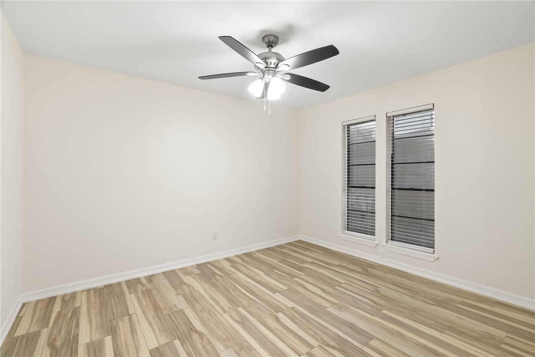1906 Oak Ridge Drive Portland, TX 78374 - Photo 19 of 20 a view of a room with window and ceiling fan