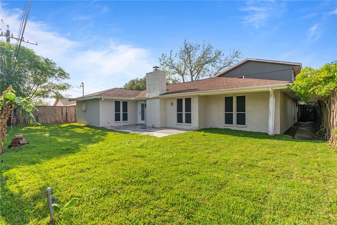 1906 Oak Ridge Drive Portland, TX 78374 - Photo 20 of 20 a front view of a house with a garden