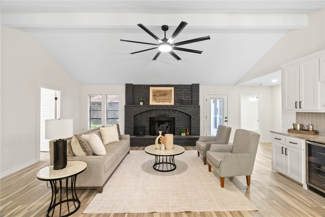 1906 Oak Ridge Drive Portland, TX 78374 - Photo 3 of 20 a living room with furniture a fireplace and a chandelier