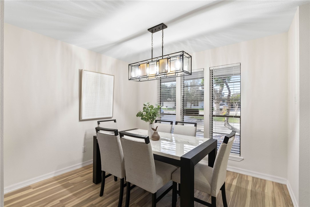 1906 Oak Ridge Drive Portland, TX 78374 - Photo 5 of 20 a view of a dining room with furniture window and wooden floor