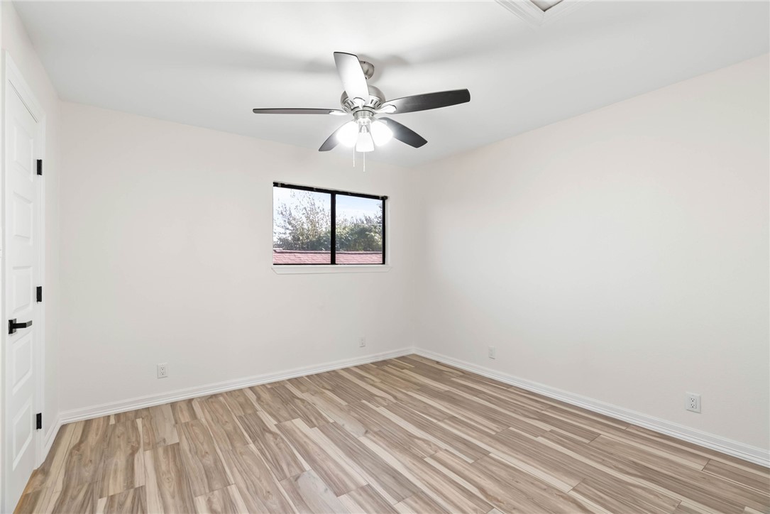 1906 Oak Ridge Drive Portland, TX 78374 - Photo 7 of 20 a view of empty room with wooden floor