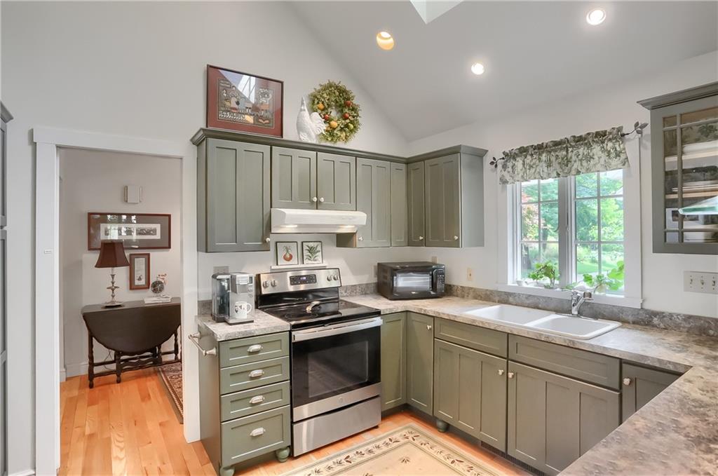 206 Reiber Road Renfrew, PA 16053 - Photo 16 of 43 a kitchen with stainless steel appliances a stove a sink and a microwave