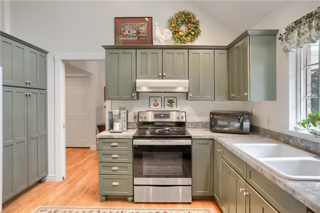 206 Reiber Road Renfrew, PA 16053 - Photo 17 of 43 a kitchen with stainless steel appliances granite countertop a stove a sink and a refrigerator