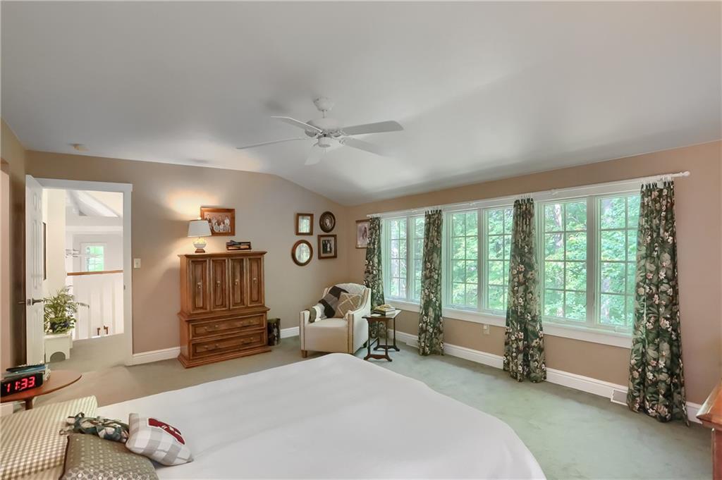 206 Reiber Road Renfrew, PA 16053 - Photo 26 of 43 a spacious bedroom with a large bed and a large window with the outer view