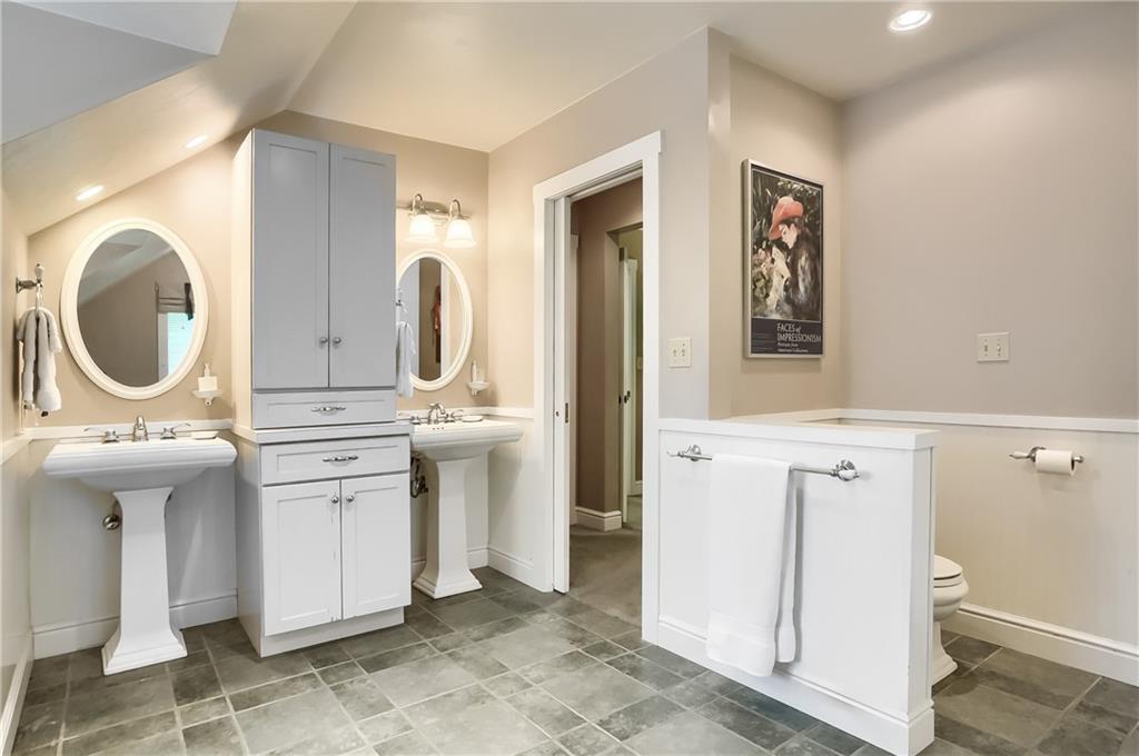 206 Reiber Road Renfrew, PA 16053 - Photo 29 of 43 a bathroom with a sink a mirror and a toilet