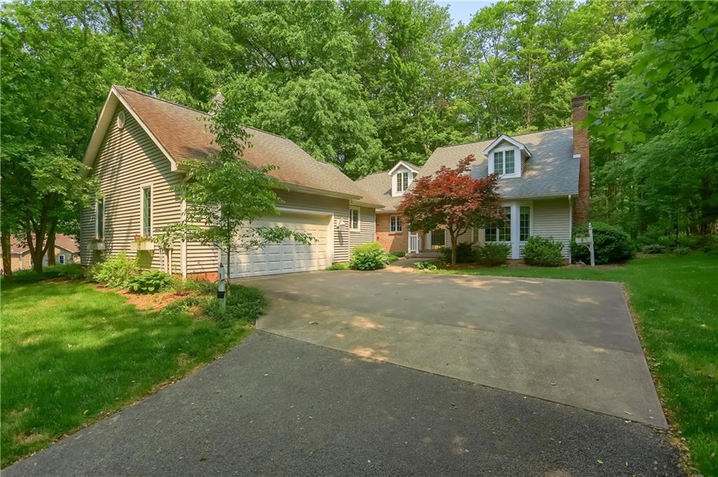 206 Reiber Road Renfrew, PA 16053 - Photo 43 of 43 a front view of a house with a garden