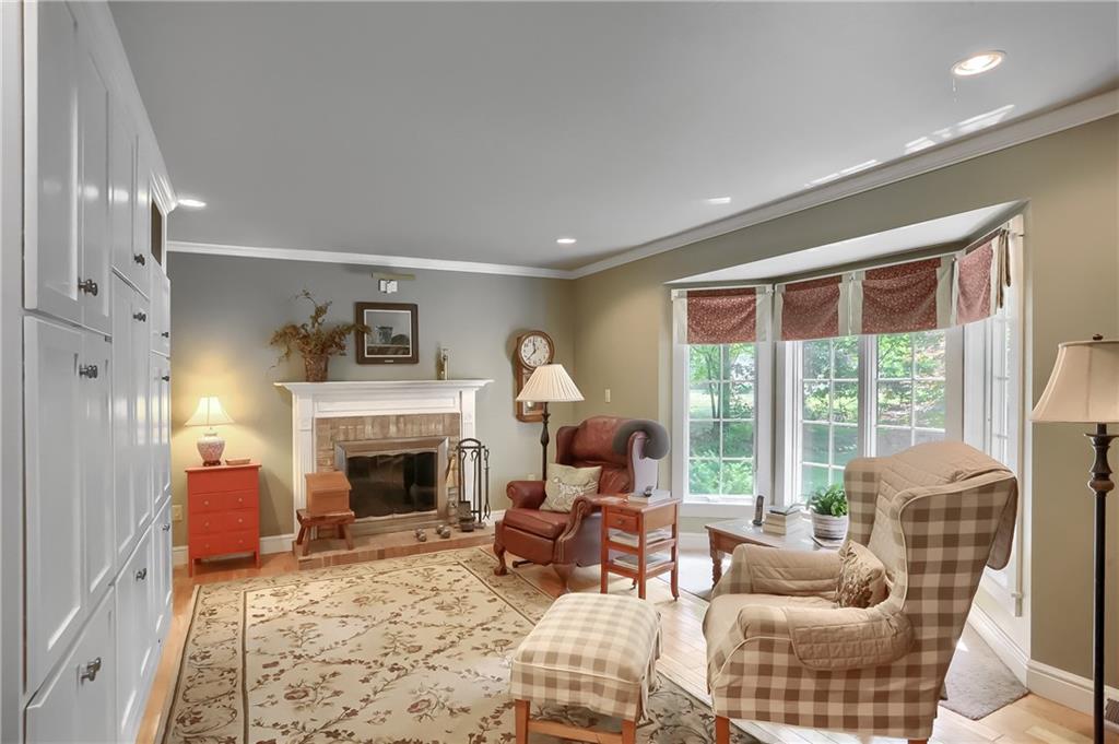 206 Reiber Road Renfrew, PA 16053 - Photo 6 of 43 a living room with furniture large window and a fireplace