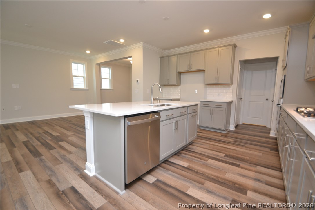 421 Canyon Spring Trail Wake Forest, NC 27587 - Photo 16 of 50 a kitchen with a sink stainless steel appliances and cabinets