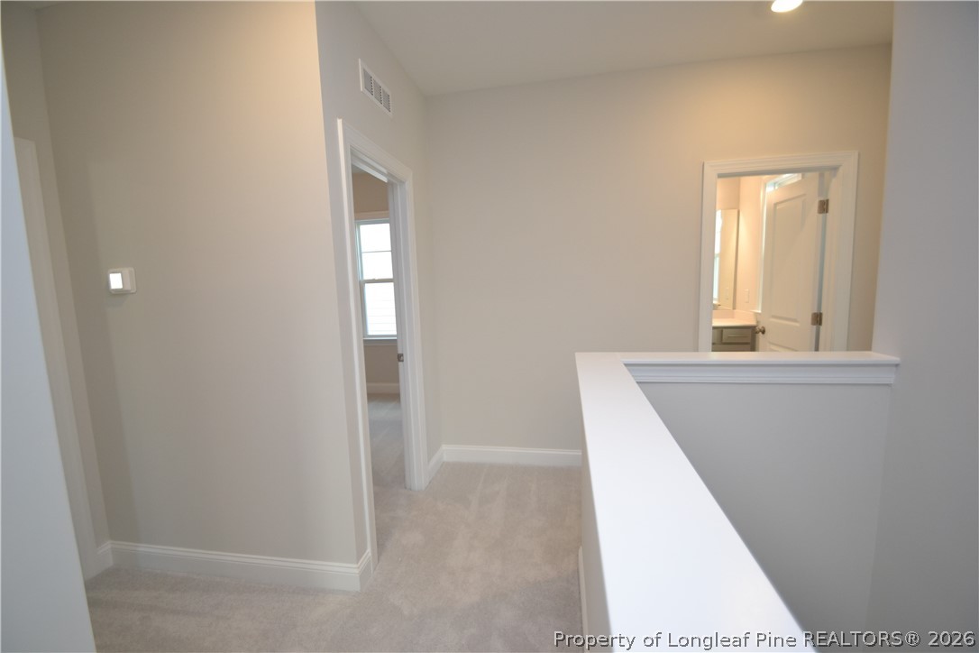 421 Canyon Spring Trail Wake Forest, NC 27587 - Photo 28 of 50 a view of a hallway with windows