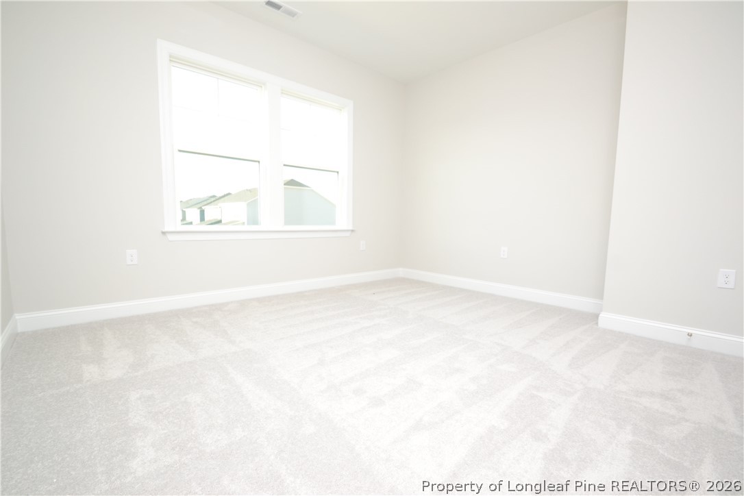 421 Canyon Spring Trail Wake Forest, NC 27587 - Photo 29 of 50 an empty room with a window