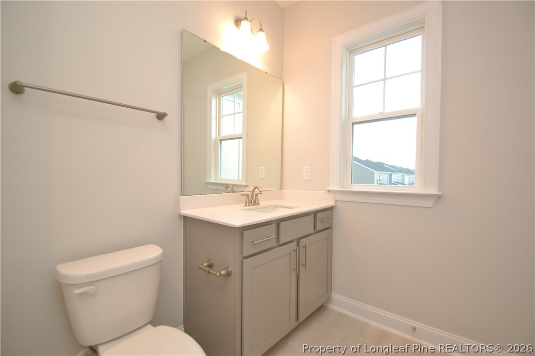 421 Canyon Spring Trail Wake Forest, NC 27587 - Photo 32 of 50 a bathroom with 2 sink toilet and a window